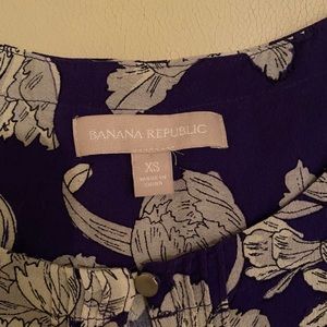 Purple top with white and gray flowers. XS